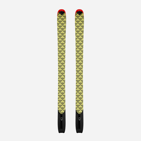 Pair of yellow/black Black Crows touring skins on a pair of Camox skis