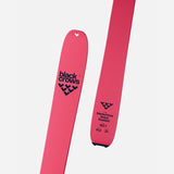 Tip and tail details of a pair of pink Black Crows Draco Freebird skis