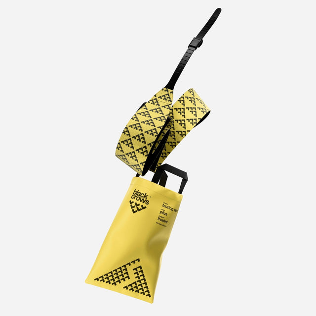 A black/yellow Black Crows touring skin with bag