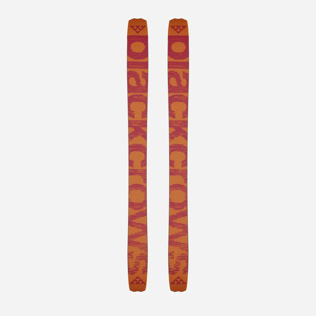 Bottom view of a pair of orange Black Crows Nocta skis