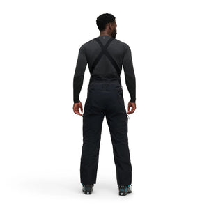 Back on-model view of men's black Black Diamond Recon Stretch bibs