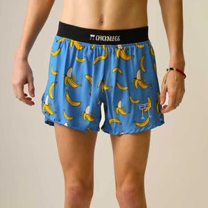 Front on-model view of men's Chicknlegs 4" half split running shorts in blue/bananas print