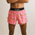 Front on-model view of men's Chicknlegs 4" half split running shorts in pink/bananas print