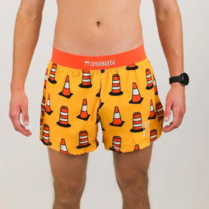 Front on-model view of men's Chicknlegs 4" half split running shorts in traffic cones print