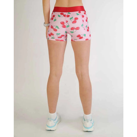Back on-model view of women's cherry print Chicknlegs compression shorts
