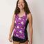 Front on-model view of women's ChicknLegs performance singlet with choccy cows print
