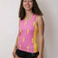 Front on-model view of women's ChicknLegs performance singlet with pink/lightning bolts print
