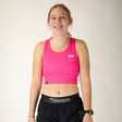 Front view of women's ChicknLegs PWR crop top in neon pink