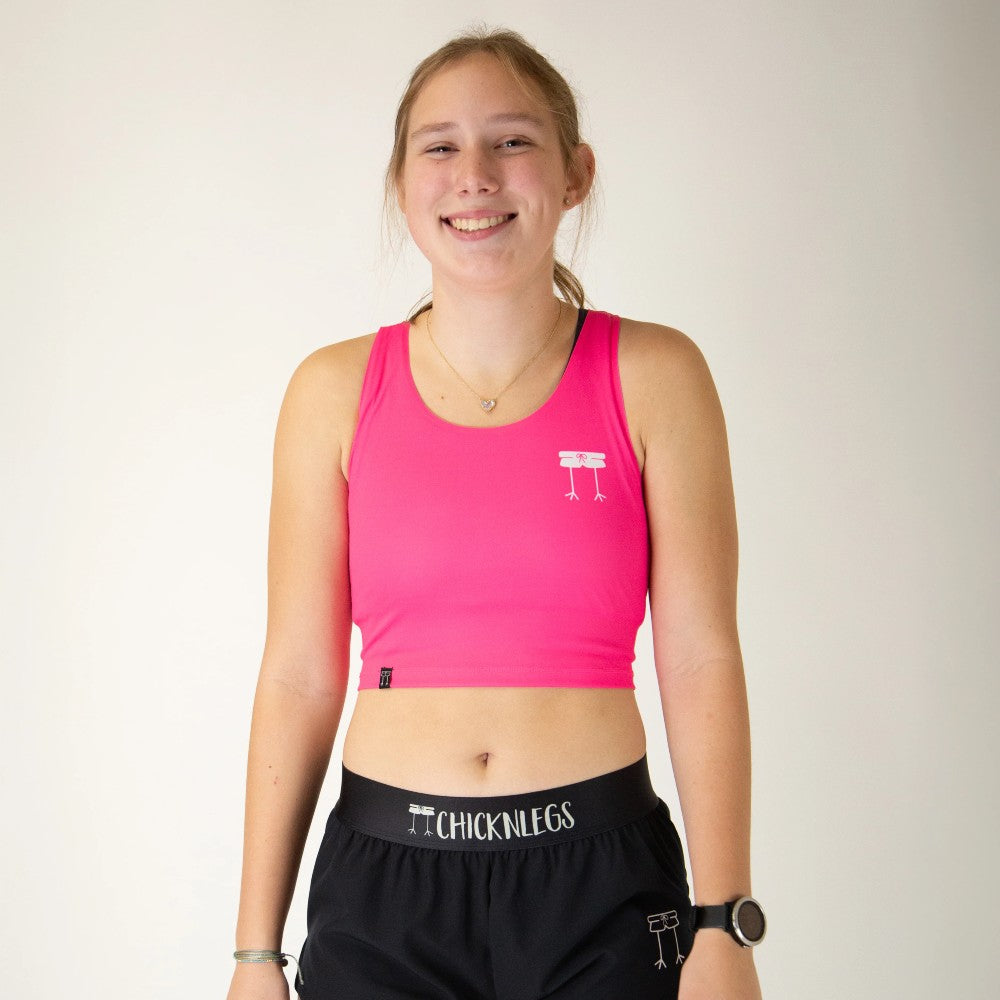 Front view of women's ChicknLegs PWR crop top in neon pink