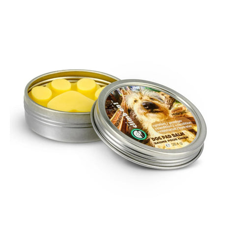 Dog pad balm in a metal tin with lid off
