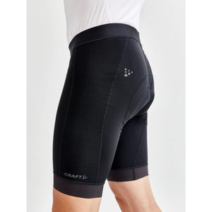 Side view on model of men's black Craft ADV Endur bike shorts