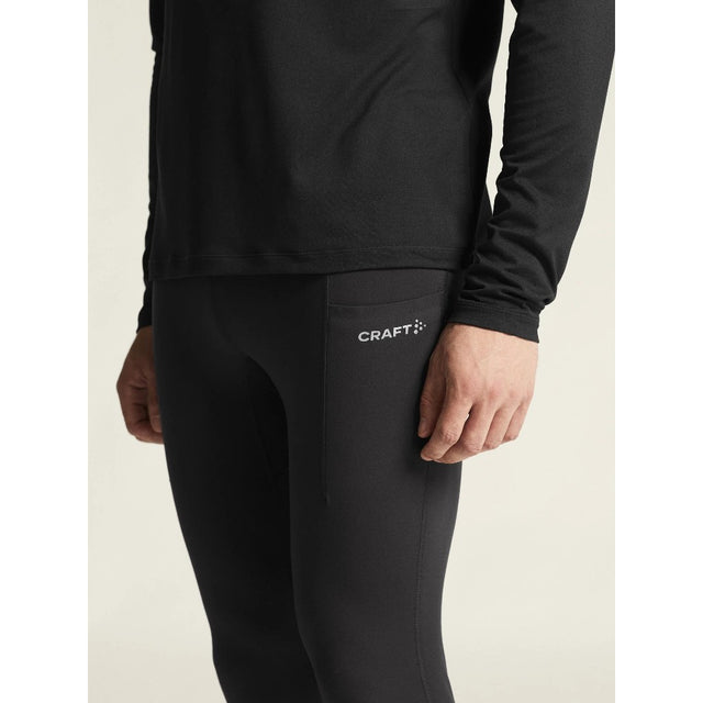 Side on-model view of men's black Craft ADV Essence warm tights