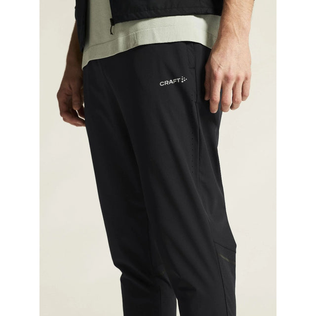 Side on-model view of men's black Craft Essence Training Pant 3