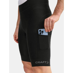 Pocket detail of men's black Craft Pro gravel bib bike shorts