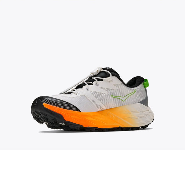 Inner side view of kids' white/orange Hoka Speedgoat 7 running shoe