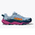 Side view of women's Hoka Torrent 4 running shoe in 'Drizzle/Fuchsia' colour