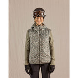 Skiier wearing women's maloja ZinkenM. technical vest in frosty green minifleur pattern