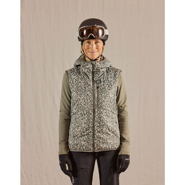 Skiier wearing women's maloja ZinkenM. technical vest in frosty green minifleur pattern