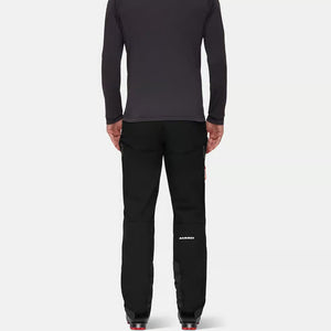 Back on-model view of men's black Mammut Taiss Guide SO pants