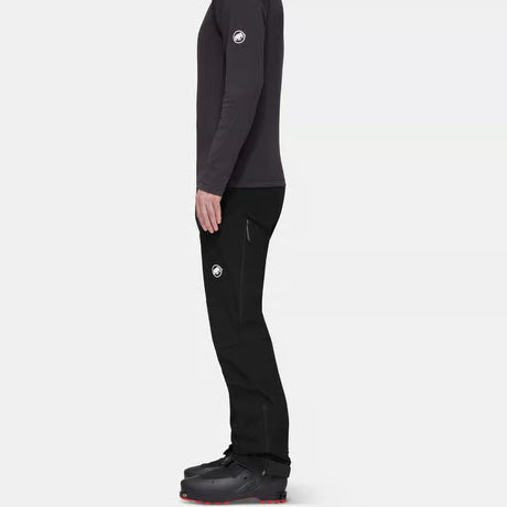 Side on-model view of men's black Mammut Taiss Guide SO pants