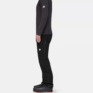 Side on-model view of men's black Mammut Taiss Guide SO pants