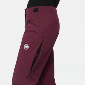 Side venting zipper detail of women's maroon Mammut Taiss Guide SO pants