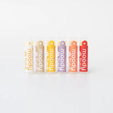Set of six moody bee lip balms standing upright