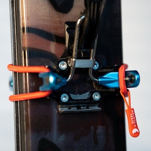 Mountain Sense C Ski Tie wrapped around pin binding on skis