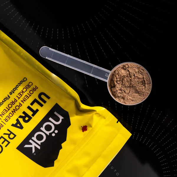 Scoop of chocolate naak protein powder