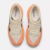 Top view of men's New Balance FuelCell Rebel v4 running shoe in mango/angora/black colour