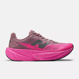 Side view of women's pink New Balance FuelCell Rebel v5 running shoe