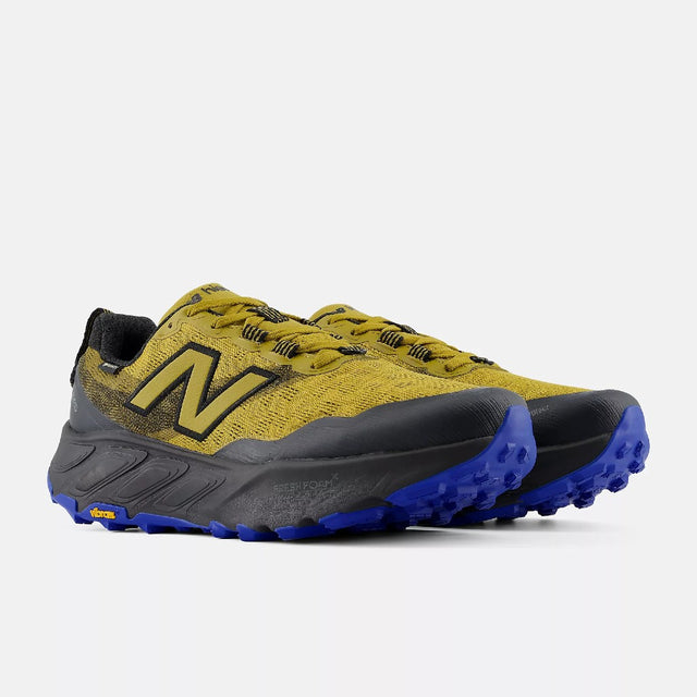 Pair of men's gold/black New Balance Hierro v9 Gore-Tex trail running shoes