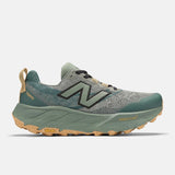 Side view of men's New Balance Hierro v9 trail running shoe in dark juniper/apricot colour