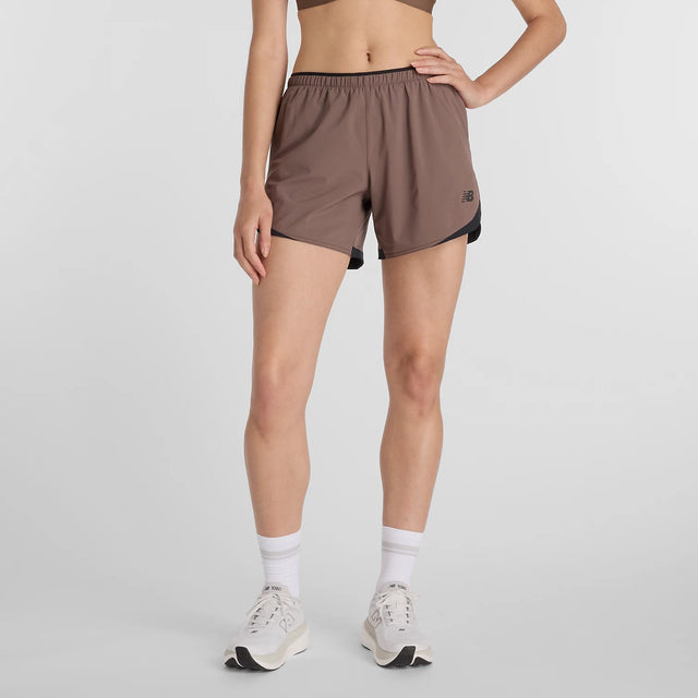 Front on-model view of women's brown New Balance RC Essential shorts