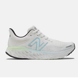 Side view of women's New Balance Fresh Foam X running shoe in White Blue