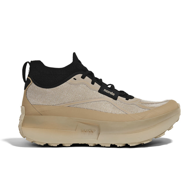 Side view of beige/black norda 055 trail running shoe