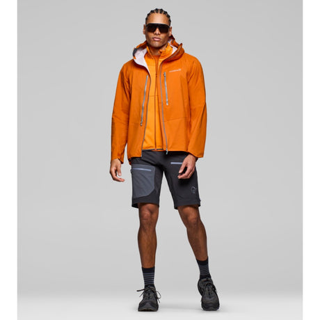 Model wearing men's norrona falketind dri1 orange waterproof jacket