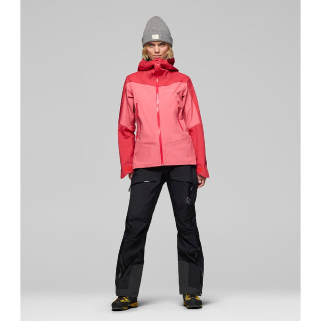 Front on-model view of women's coral Norrona falketind Gore-Tex jacket