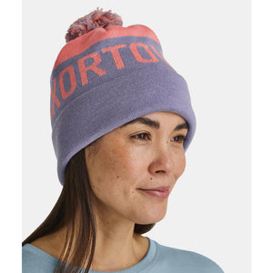 Model wearing Ortovox Bobble Knit Beanie in blossom colour