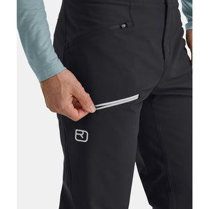 Side pocket detail of men's black Ortovox Pizol softshell pants