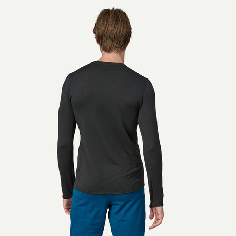 Back on-model view of men's black Patagonia Capilene thermal crew long sleeve