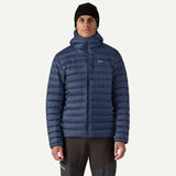 Front on-model view of men's navy Patagonia down sweater hoody