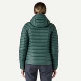 Back on-model view of women's green Patagonia down sweater hoody
