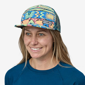 Model wearing geo/salamander green patagonia duckbill truck hat