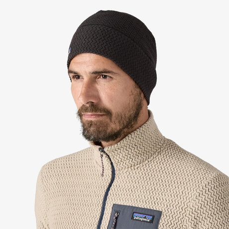 Front on-model view of black Patagonia R1 Air Beanie