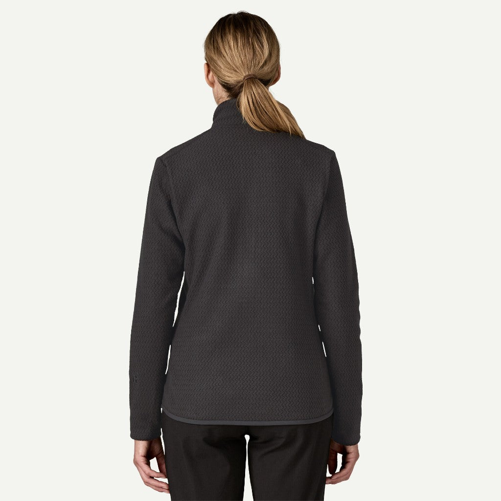Back on-model view of women's black Patagonia R1 Air fleece jacket