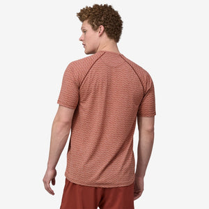 Back on-model view of men's Patagonia Ride Flow Shirt in mangrove red