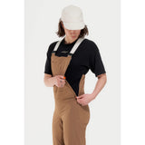 Side zip detail of women's brown Peppermint Cycling overalls