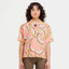 Front on-model view of women's banana/grapefruit print Peppermint Cycling shirt