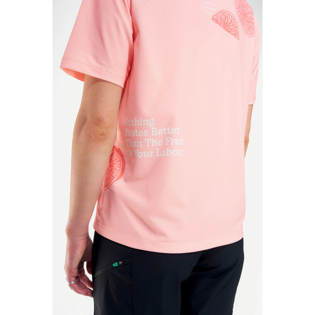 Side print detail view of women's grapefruit Peppermint Cycling t-shirt